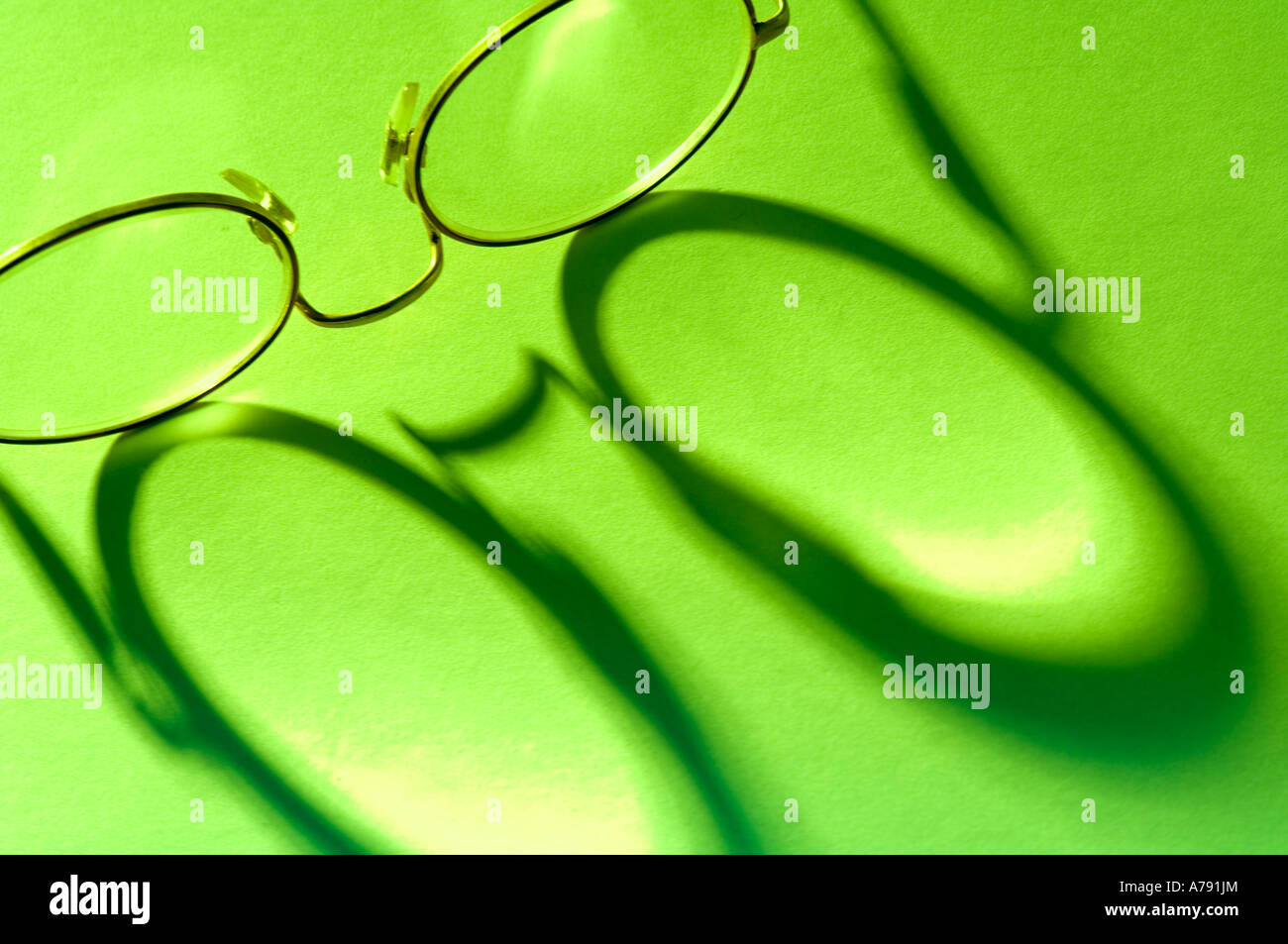 glasses shadow on paper Stock Photo