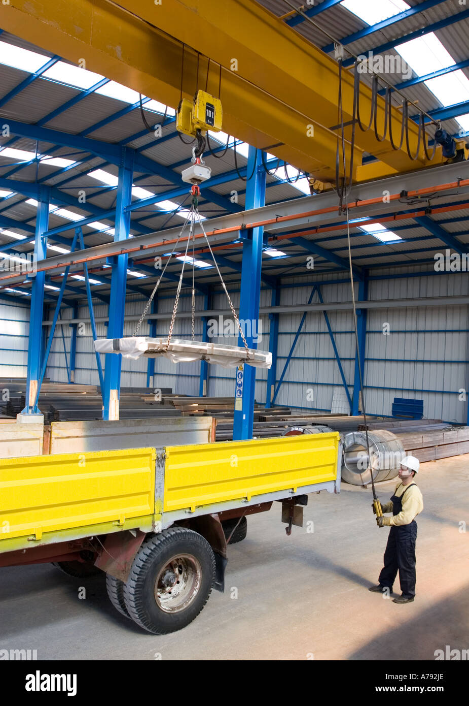 Cargo lifting crane machine in warehouse, industrial environment