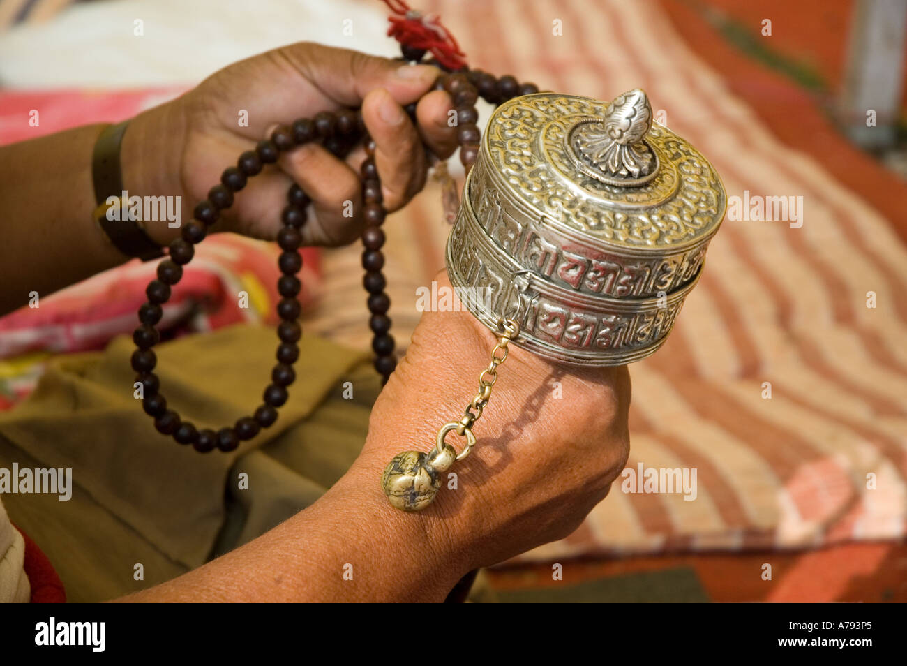 Tibetan prayer wheel and Mala Stock Photo