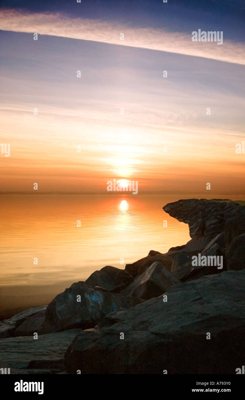 Plane trail at sunset, Ards Peninsula, County Down, Northern Ireland Stock Photo