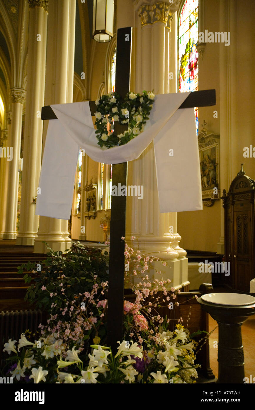 CHICAGO Illinois Interior of St Michaels Catholic Church draped cross lilies Easter holy water basin Stock Photo