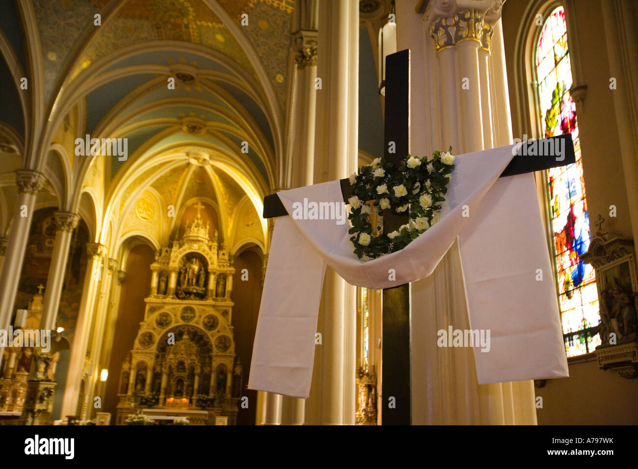 CHICAGO Illinois Interior of St Michaels Catholic Church draped cross lilies Easter Old Town neighborhood Stock Photo