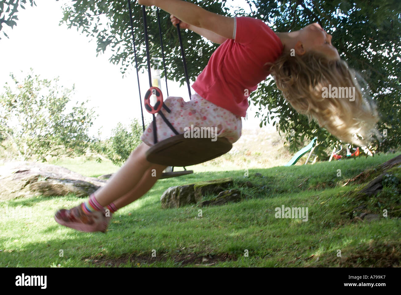 Girl on swing in tree hi-res stock photography and images - Page 18 - Alamy