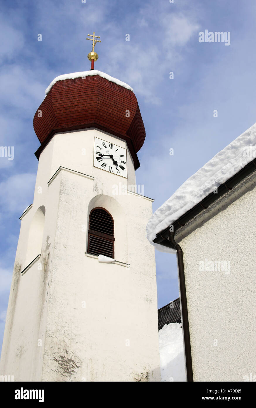 Clock tower of St. Anton church in winter, St. Anton am Arlberg, Tirol, Austria Stock Photo