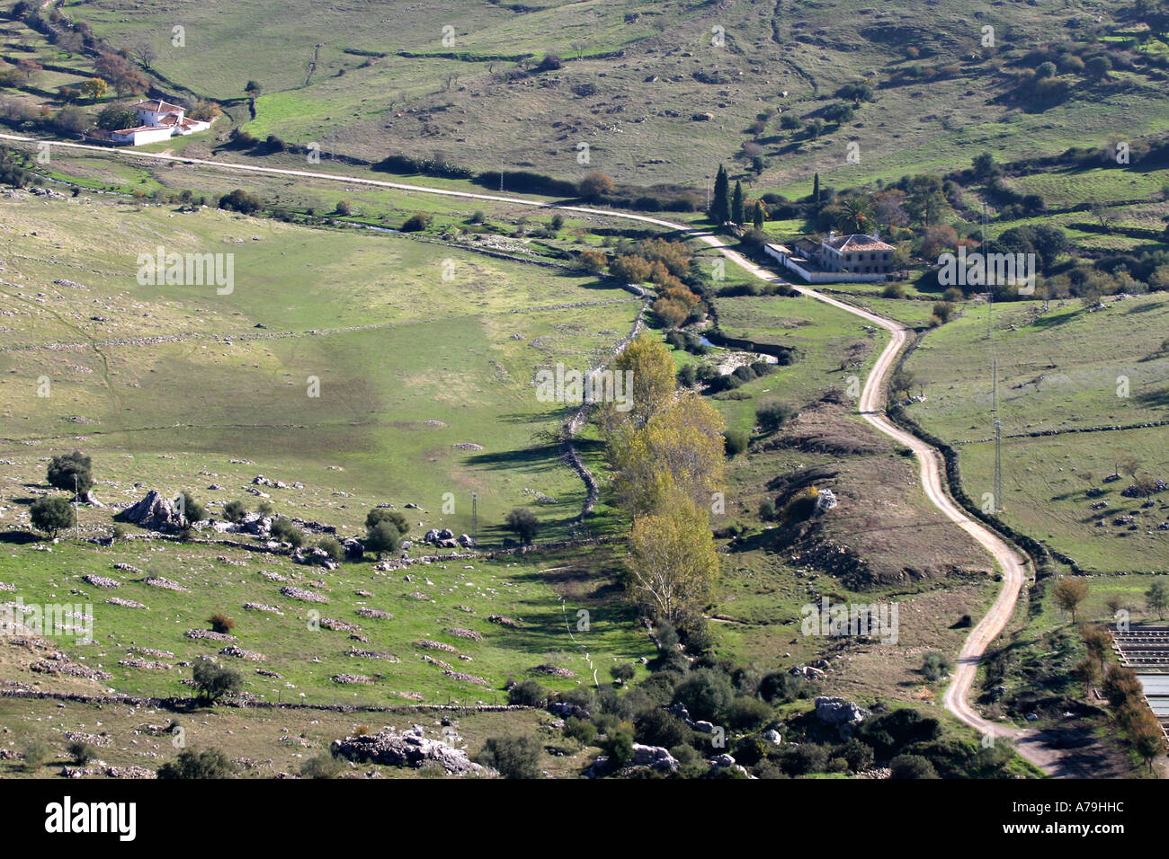 Hinterland: View of green fields and winding road ouside Grazamela from high above in the town Stock Photo