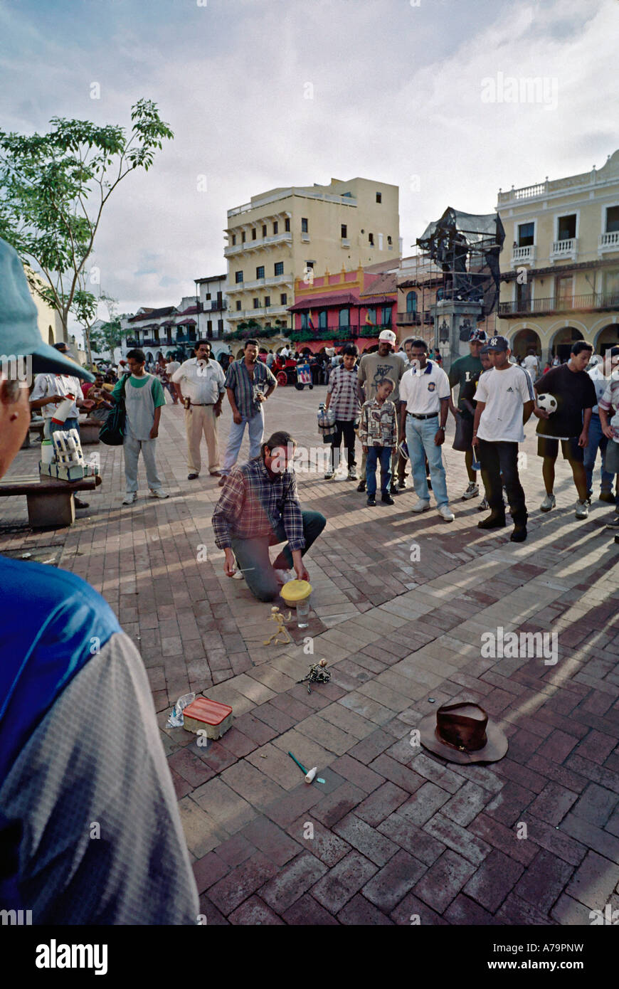 Street entertainer salesman with a crowd of spectators in a plaza in Old Town Cartagena Colombia Stock Photo