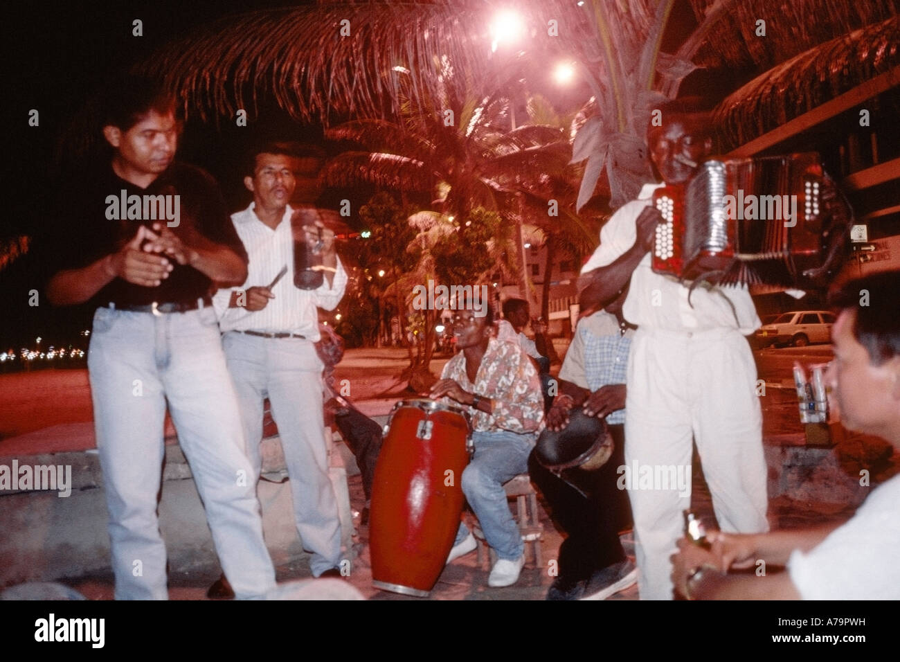 Musical group playing cumbia at night on the beach at Bocagrande near Cartagena Colombia Stock Photo