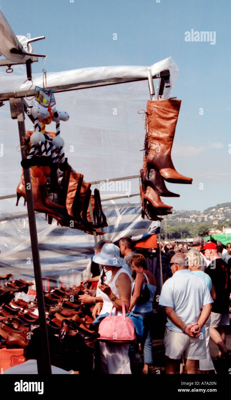 Boots hanging from a Spanish market stall Stock Photo