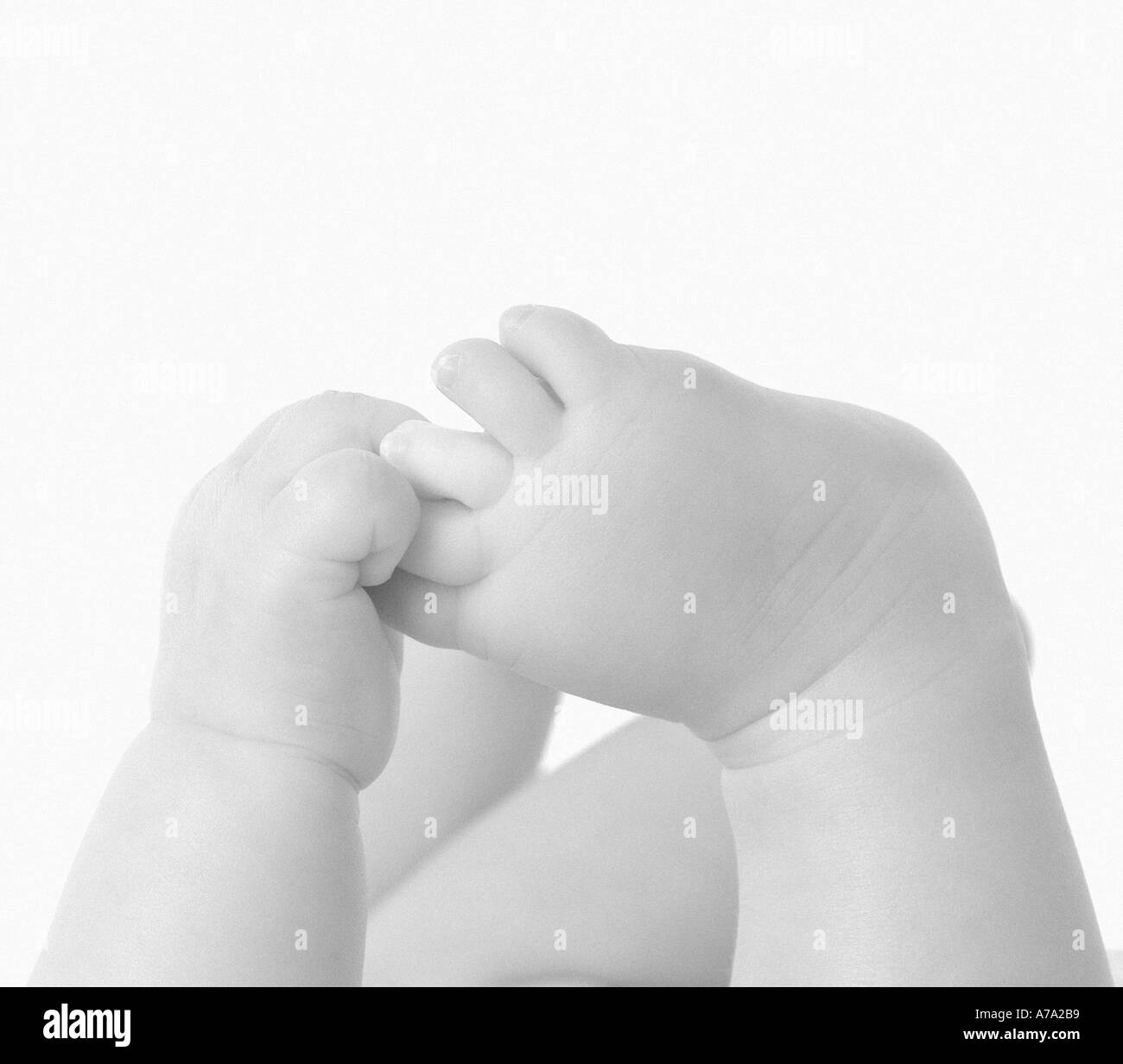 Baby playing with feet Stock Photo - Alamy