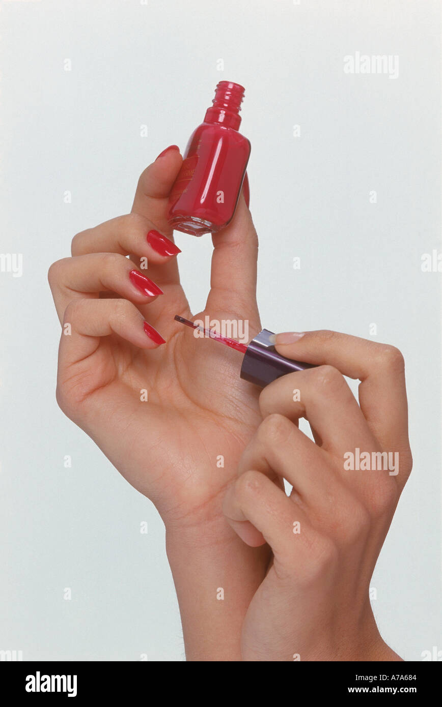 woman applying nail polish Stock Photo