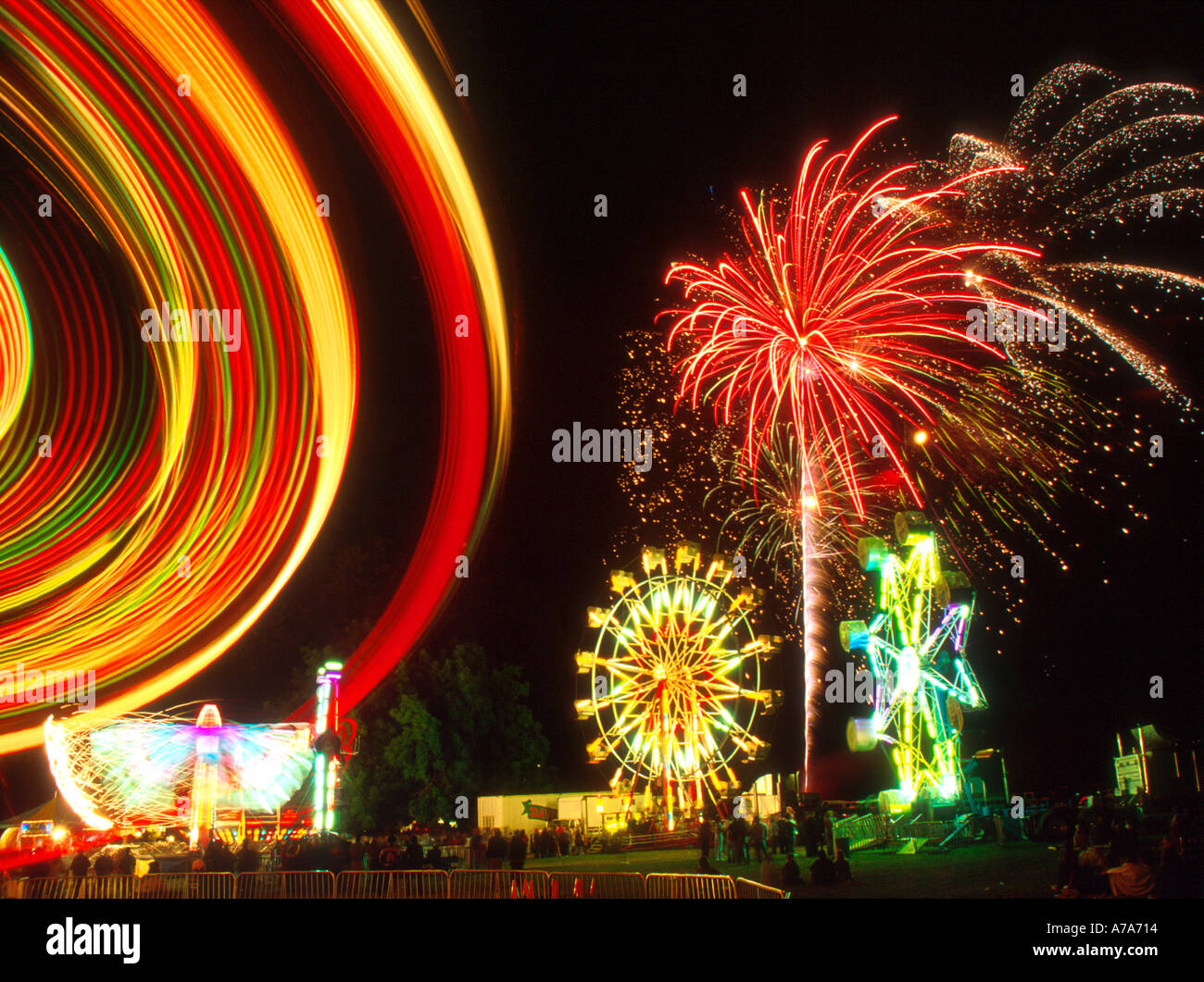 carnival rides and fireworks on the fourth of July celebration in