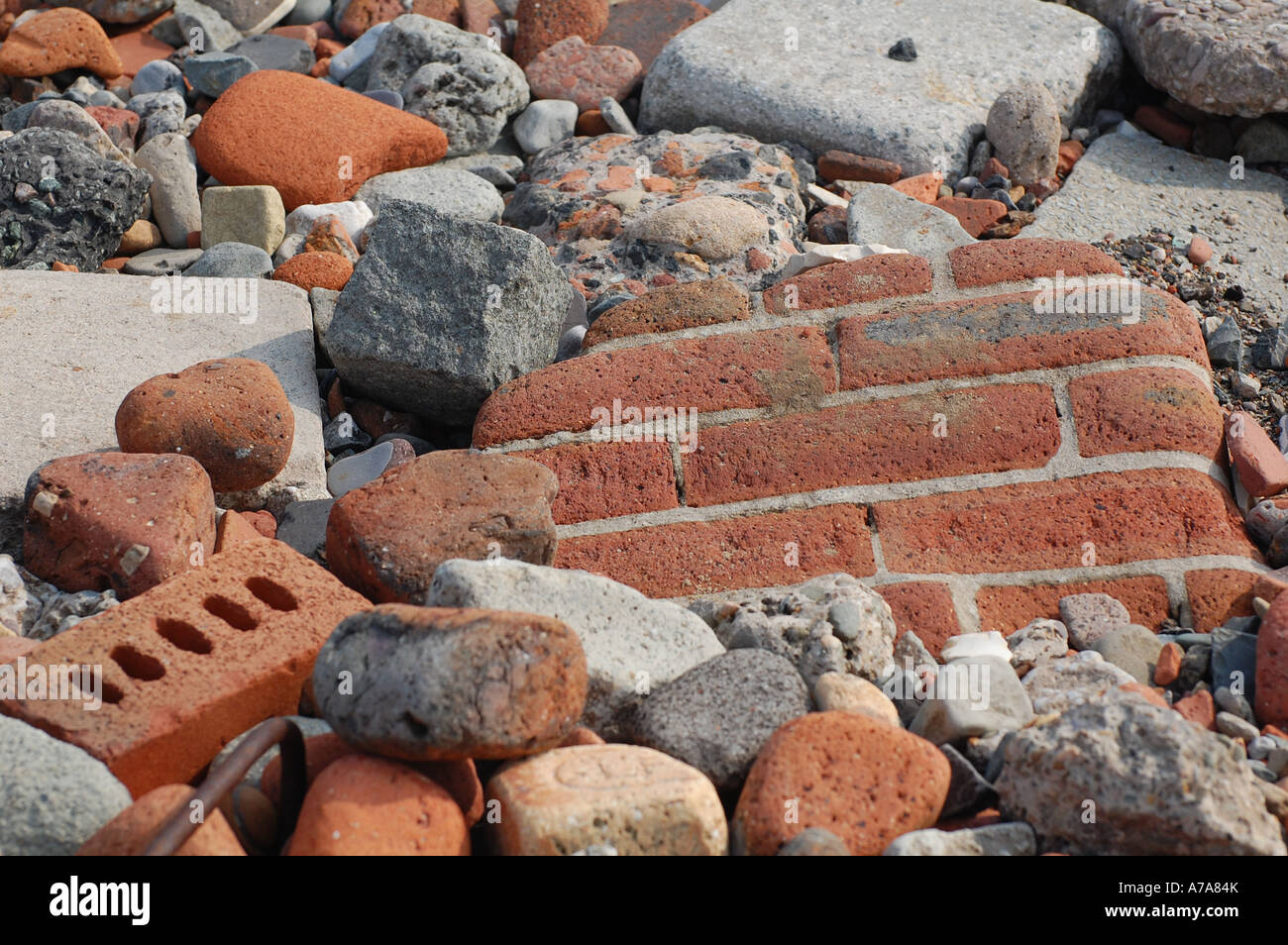 Weathered bricks from second world war damaged houses on Crosby Beach ...