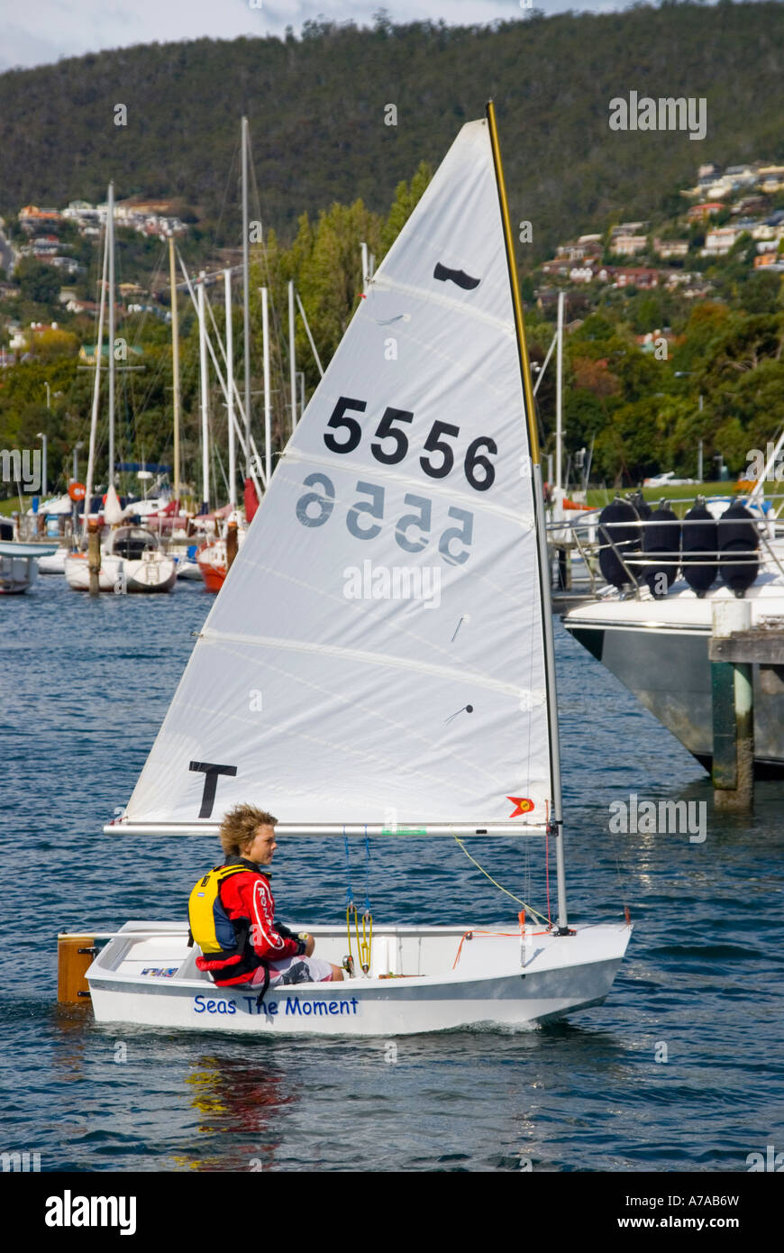 A young boy sailing a Sabot dinghy Stock Photo - Alamy
