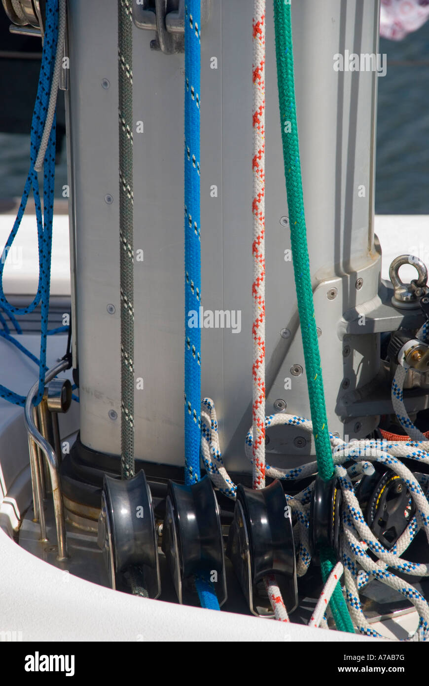 Colour coded halyards on the mast of a large cruising yacht Stock Photo