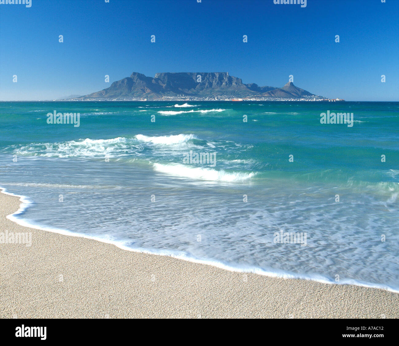 Table Mountain and the city of Cape Town seen across Table Bay from Bloubergstrand. Stock Photo