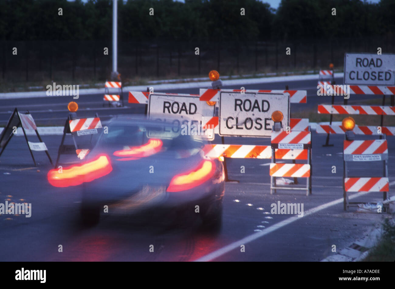 road closed with detour barricades set up with lights Stock Photo
