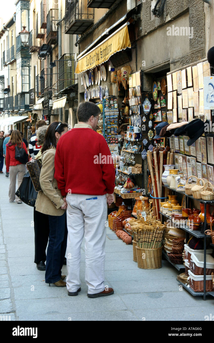 People buying souvenirs from one of the gift shops by the cathedral in Segovia, Spain Stock Photo