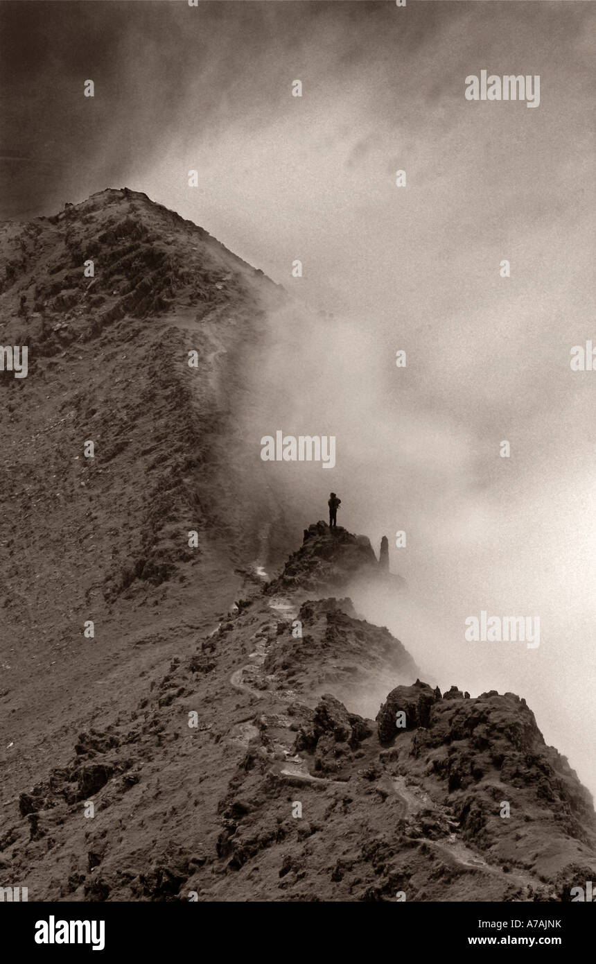 A lone climber in the mist on the south ridge of snowdon Stock Photo