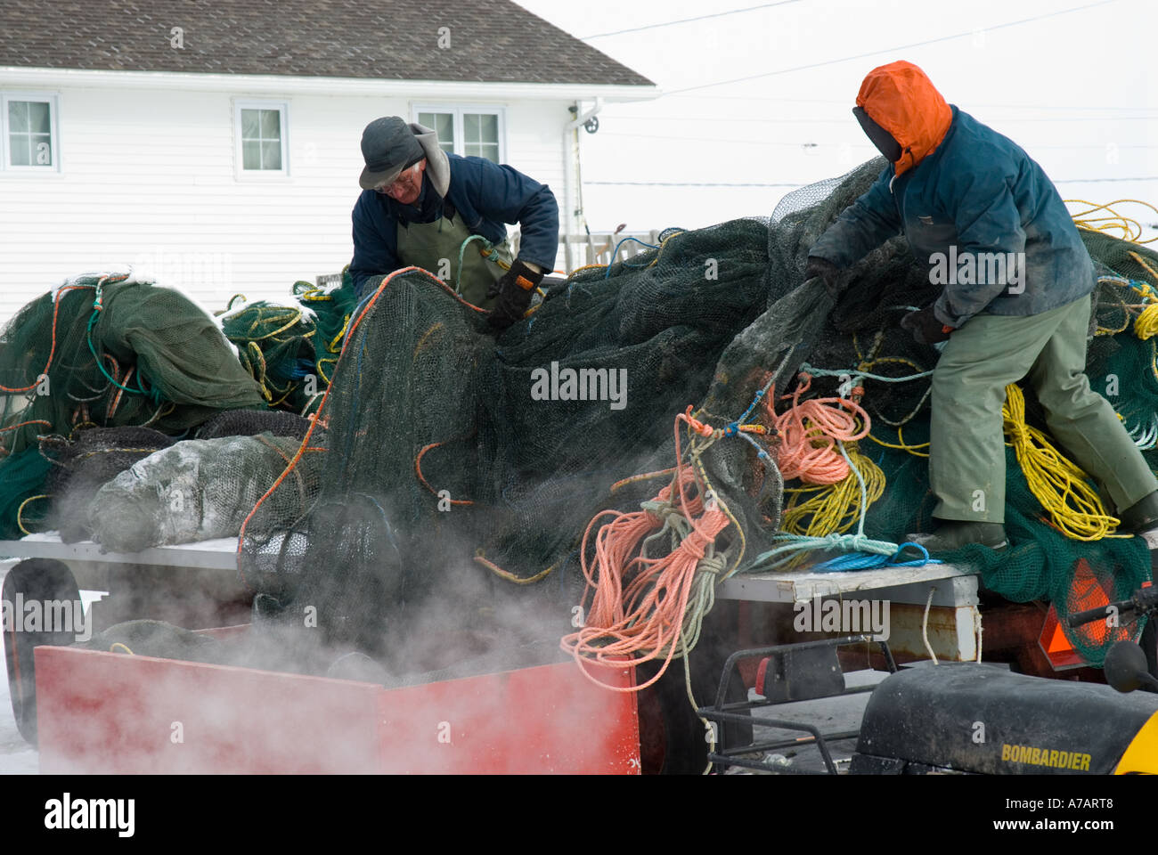 Smelt Fishing through the ice on a freezing cold winter day on