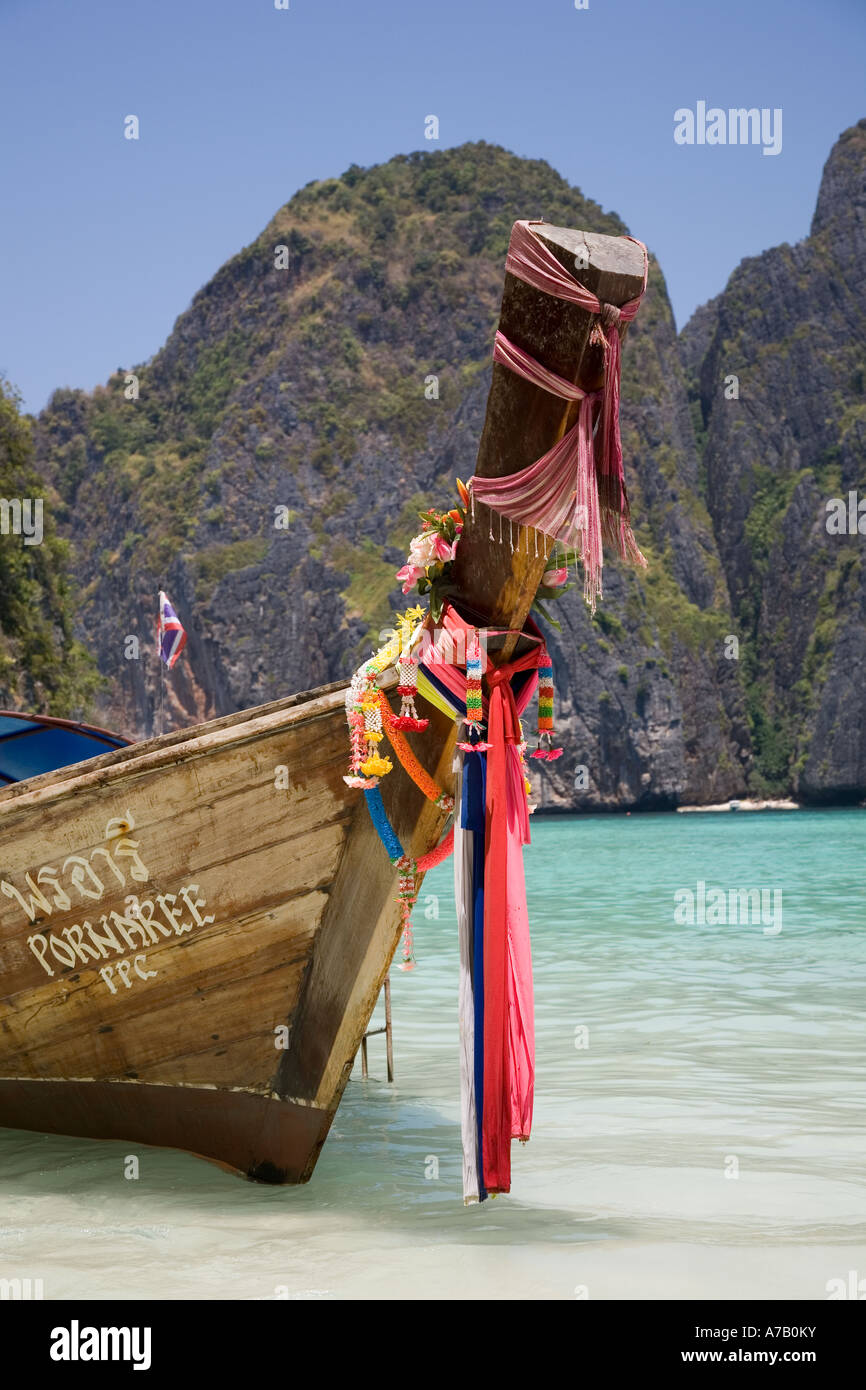 Prows of Asian wooden longtail boats;  long tailed boat prow with Buddhist garlands, Ko Phi-Phi Don island, Maya Bay,  Krabi Province, Thailand, Asia Stock Photo