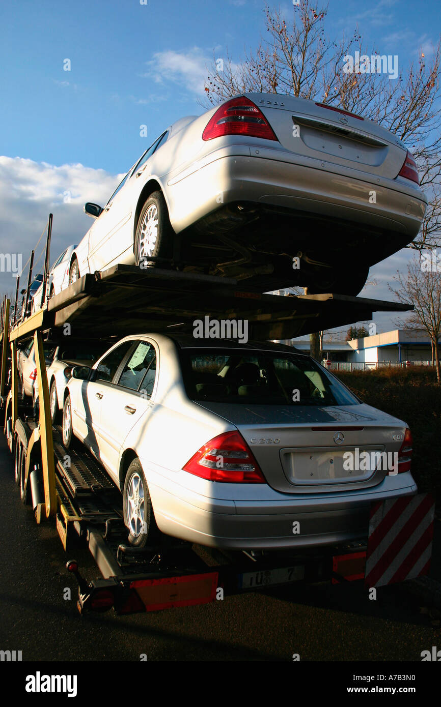 mercedes cars being transported from factory to dealer. (c) by uli