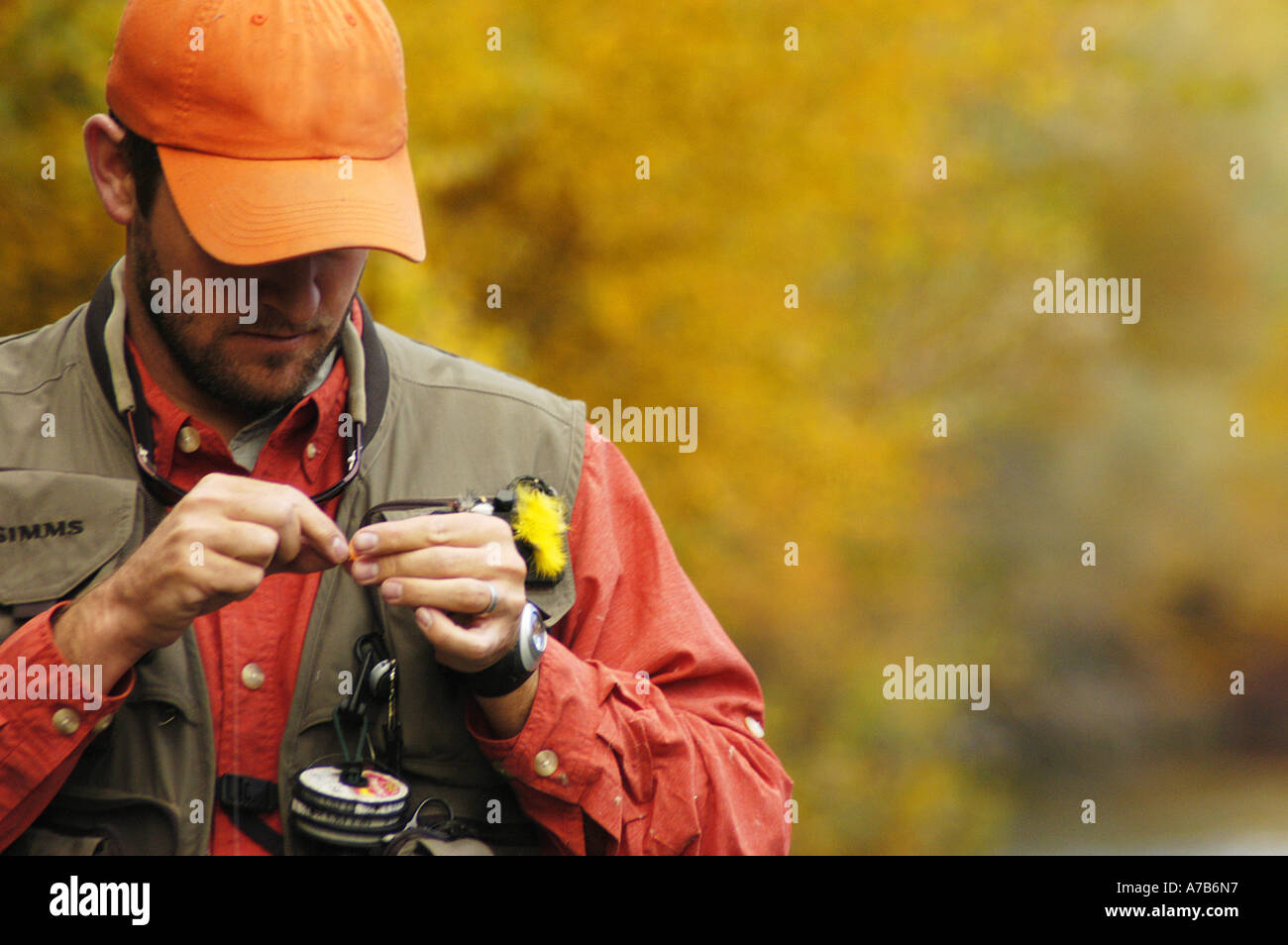 Idaho Mackay Big Lost River Close up of a man tying on a fly while fly