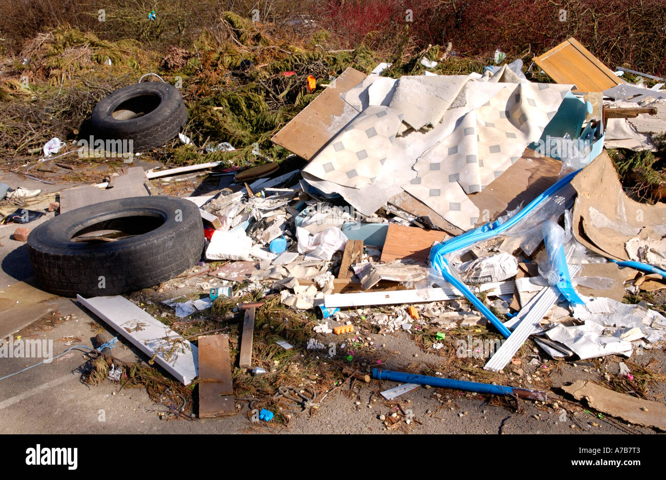 Rubbish left by caravan travellers dumped in car park of disused