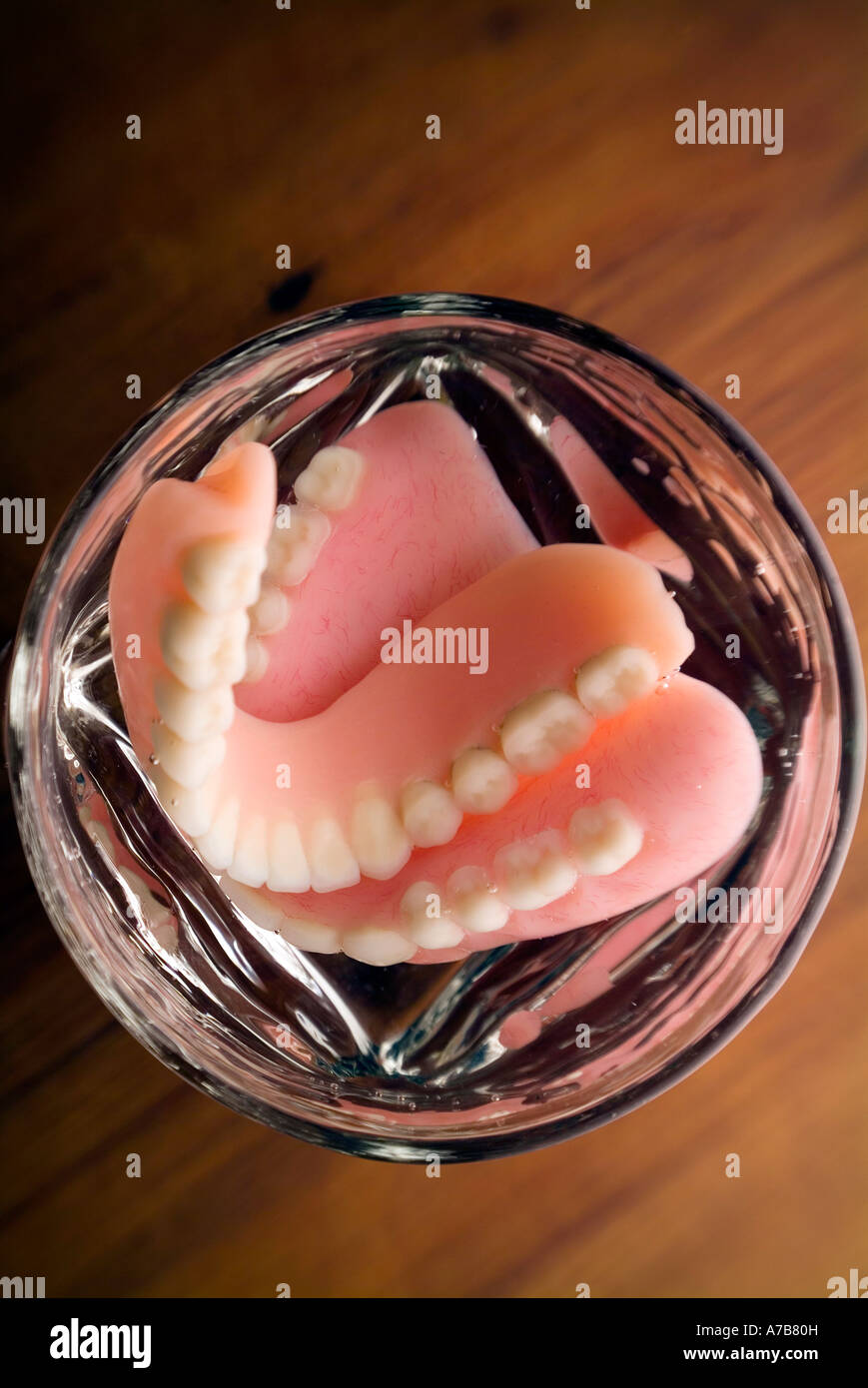 False teeth in a drinking glass Stock Photo Alamy