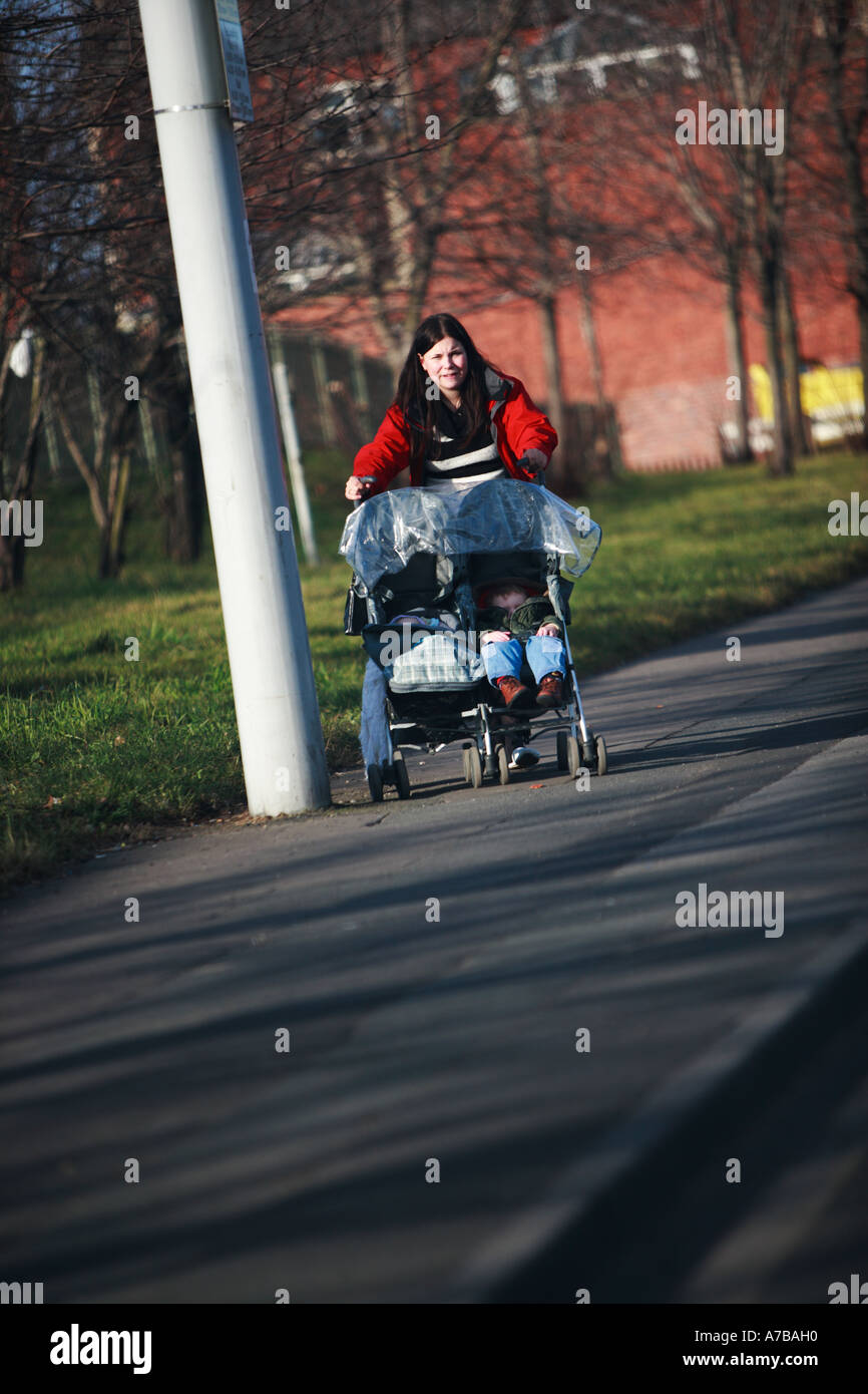 Leeds Lady Pushing Pram Stock Photo Alamy