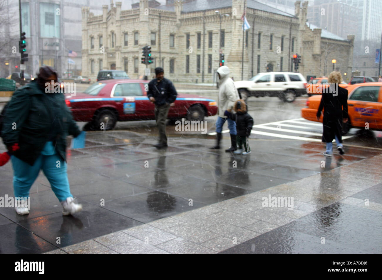 people walking in a rain storm Michigan Avenue, Chicago, IL USA Stock Photo