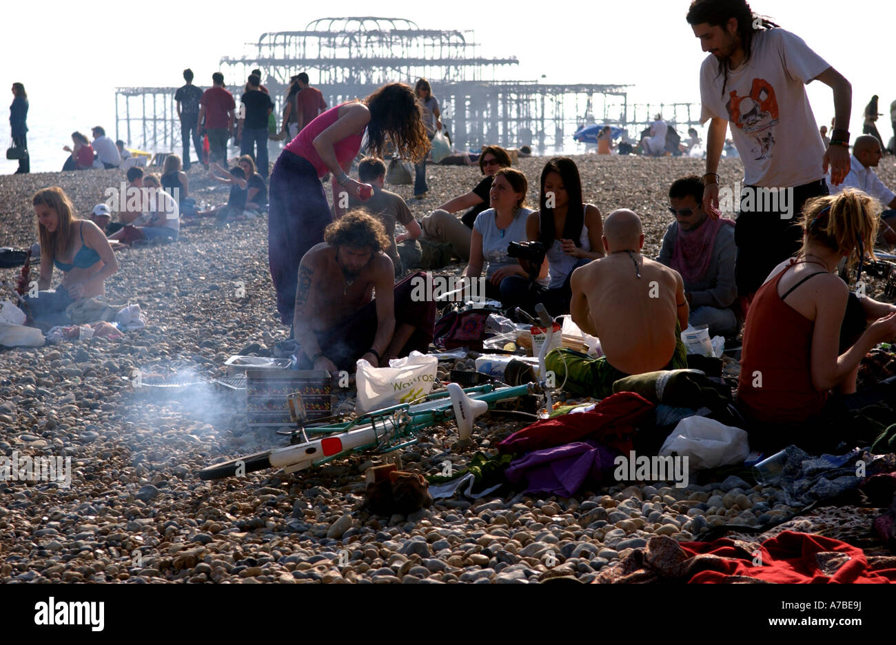 A group of people enjoy a barbecue on Brighton beach UK Stock Photo