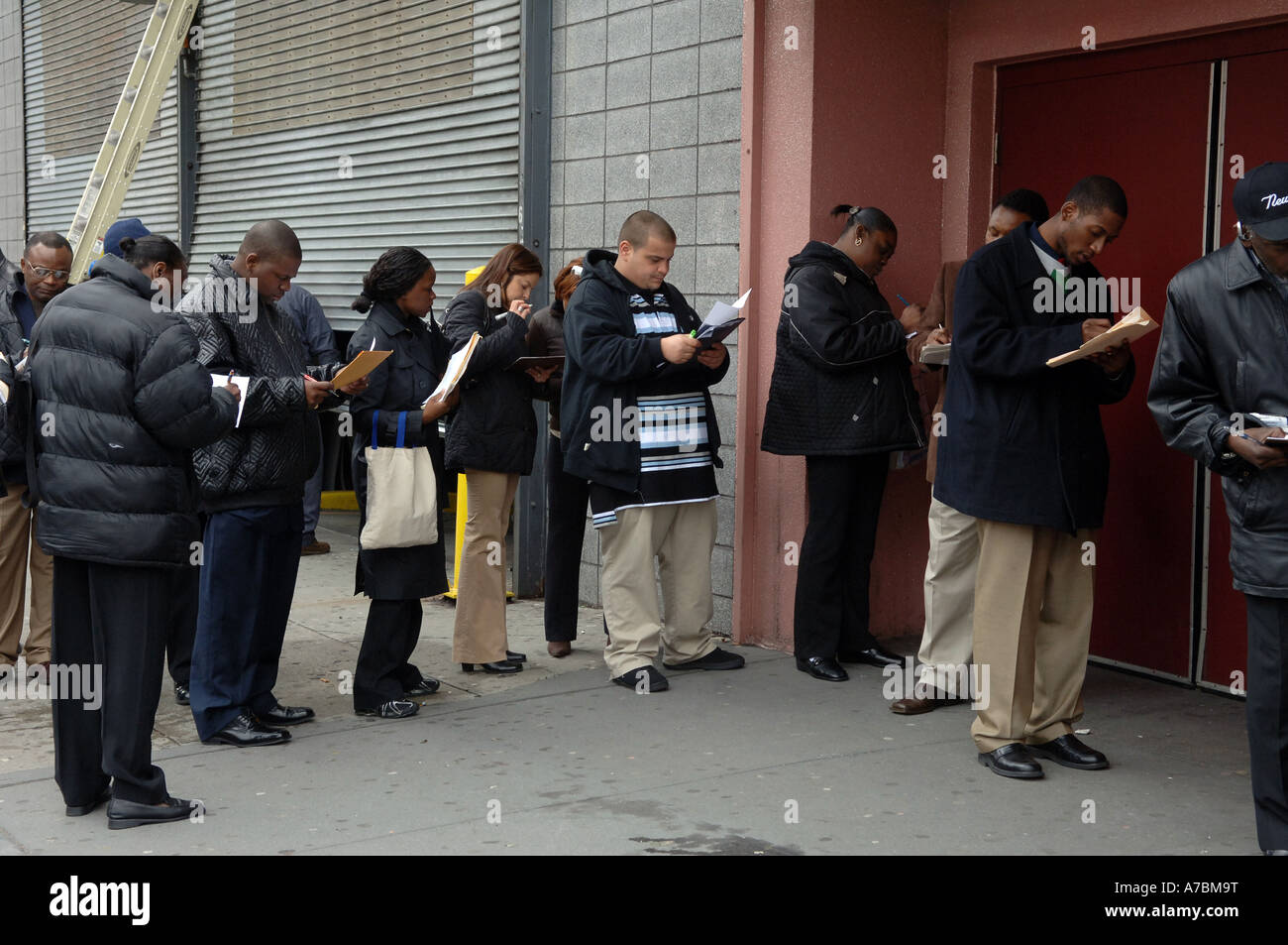 Potential employees queue up at job fair Stock Photo Alamy
