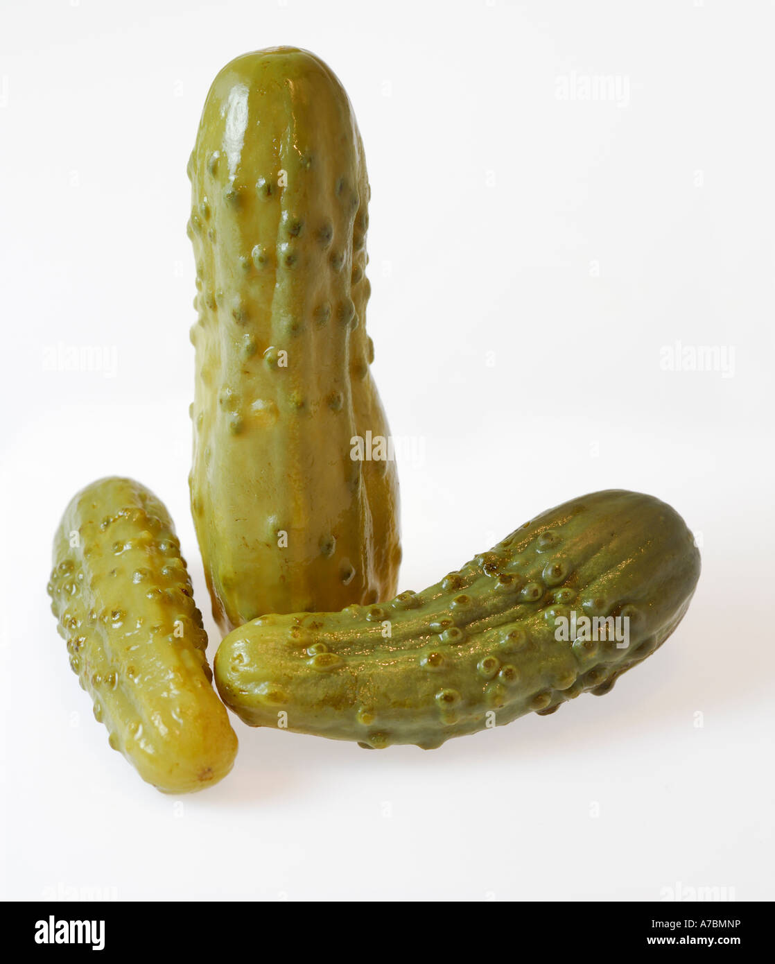 Three pickled cucumbers on white Stock Photo