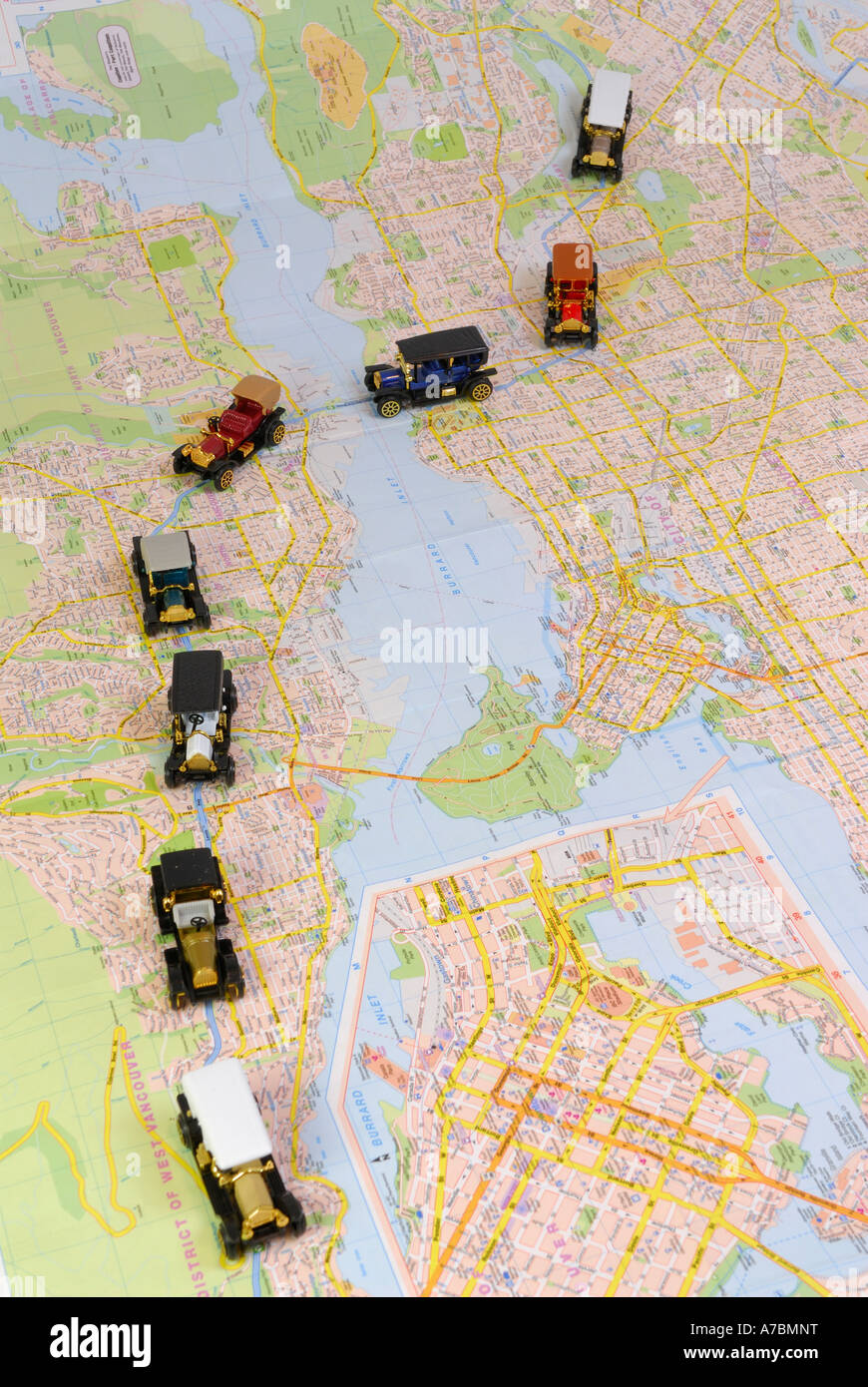 Antique toy car convoy on map of Vancouver Stock Photo Alamy