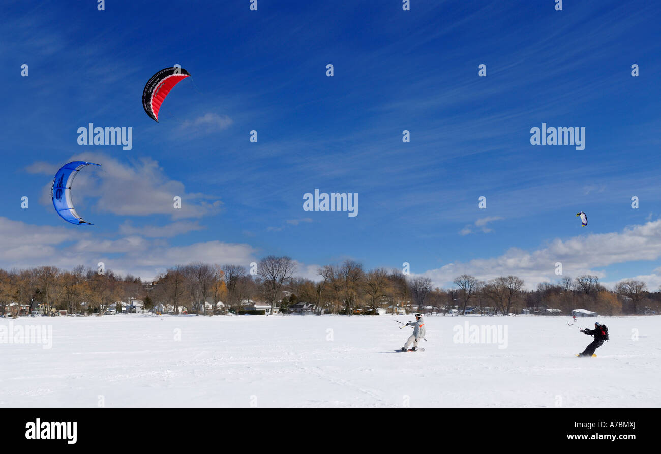 Two snowkiters racing at Keswick kite beach on frozen Lake Simcoe Ontario Canada Stock Photo