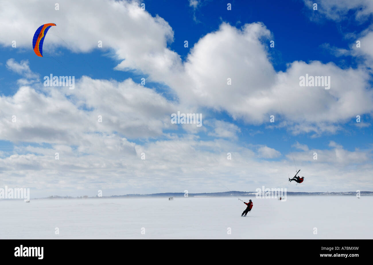 Snowkiter and aerial manouver flip on frozen Lake Simcoe Ontario Stock Photo