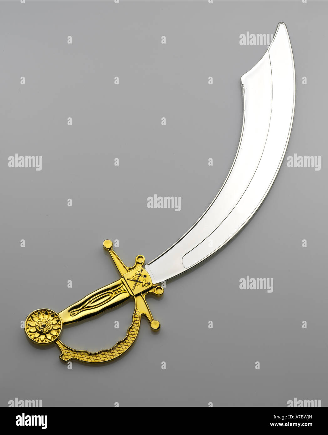 sword, saber, close up, gray background, gold handle, sandokan, blade, iron, sharp, battle, combat, heavy, large, toy, plastic Stock Photo
