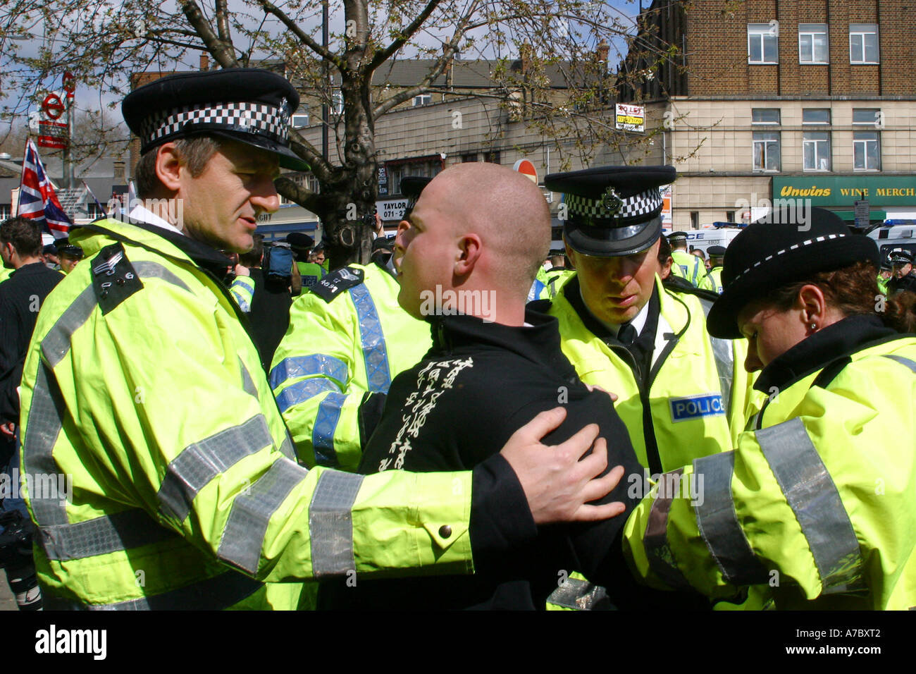 A BNP member being arrested by Police at a BNP Rally outside Finsbury Park Mosque, London. Stock Photo