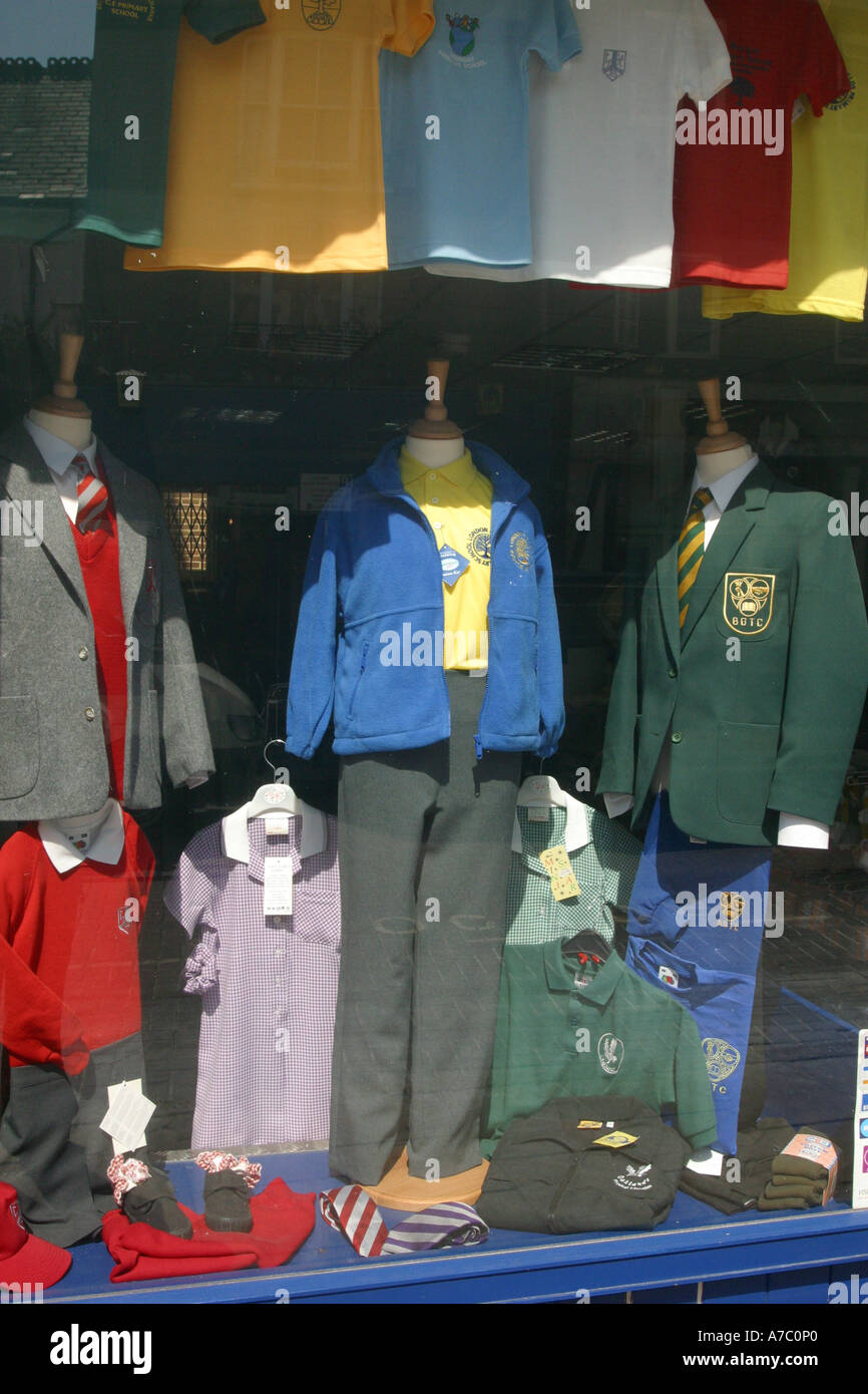 Store window displaying children's school uniforms Stock Photo Alamy