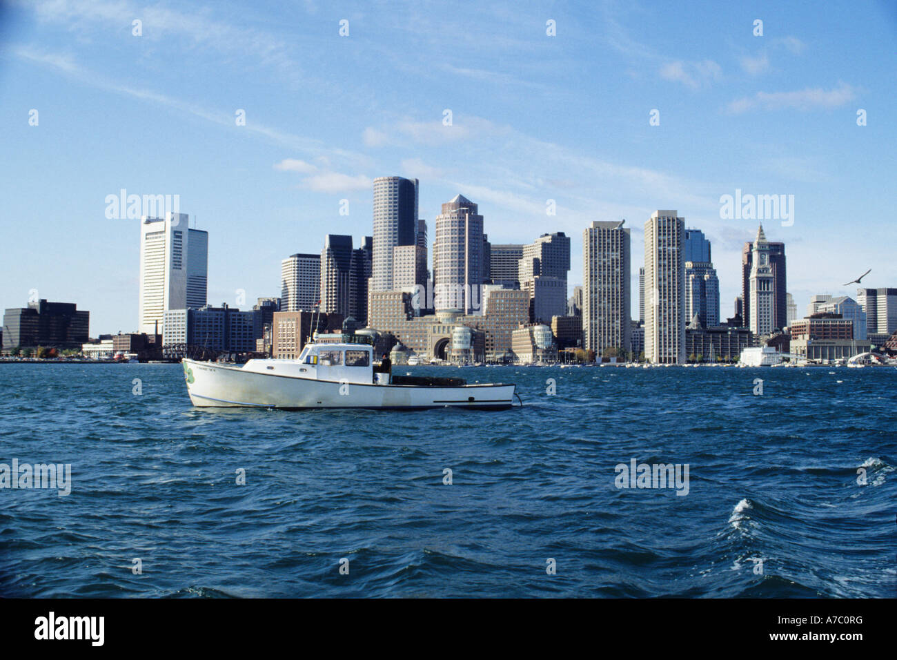 Lobster Fishing Boat in Boston Harbor with the City skylinein the