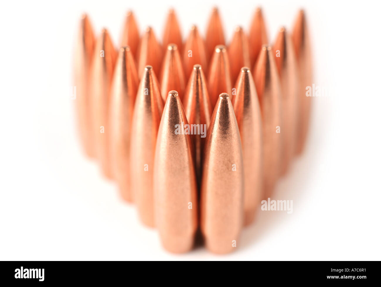 Group of bullets standing in rows. 308 rifle bullets arranged in rows ...