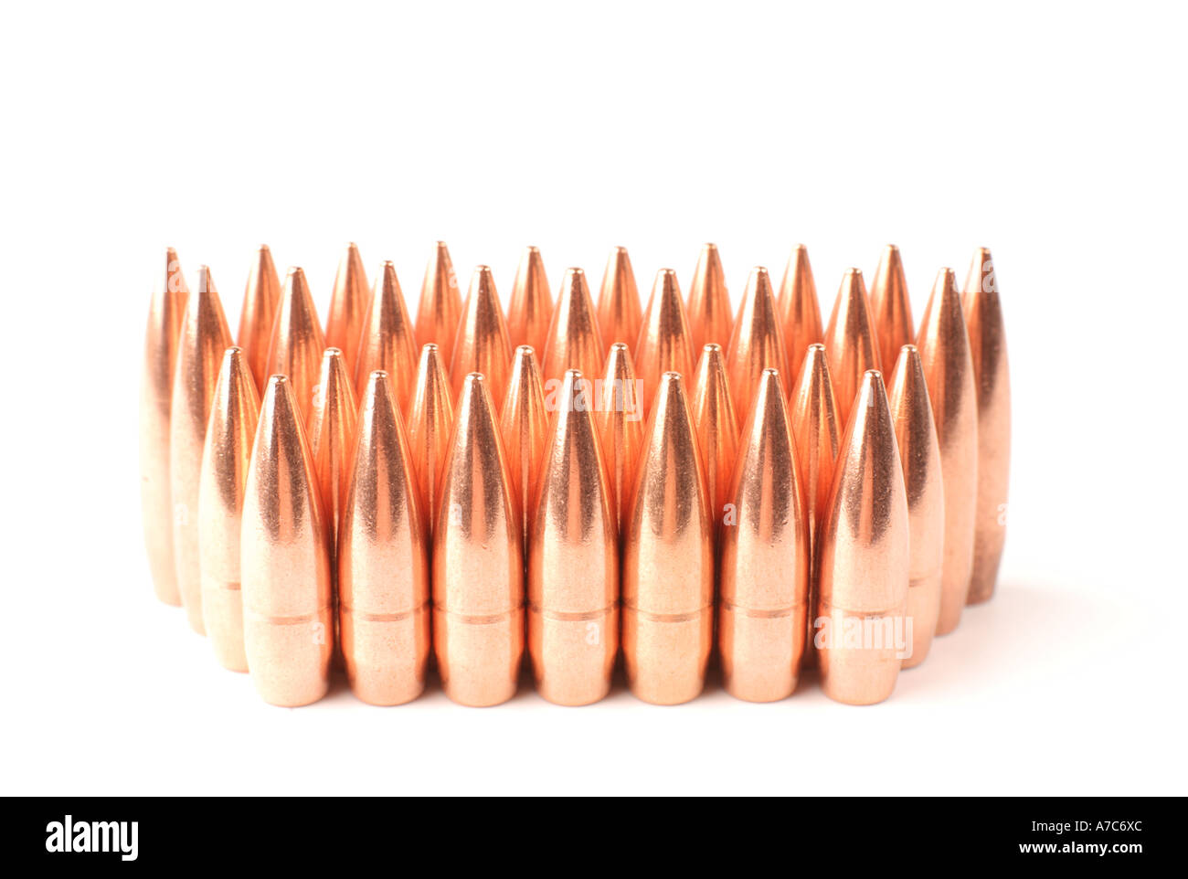 Group of bullets standing in rows. 308 rifle bullets arranged in rows ...