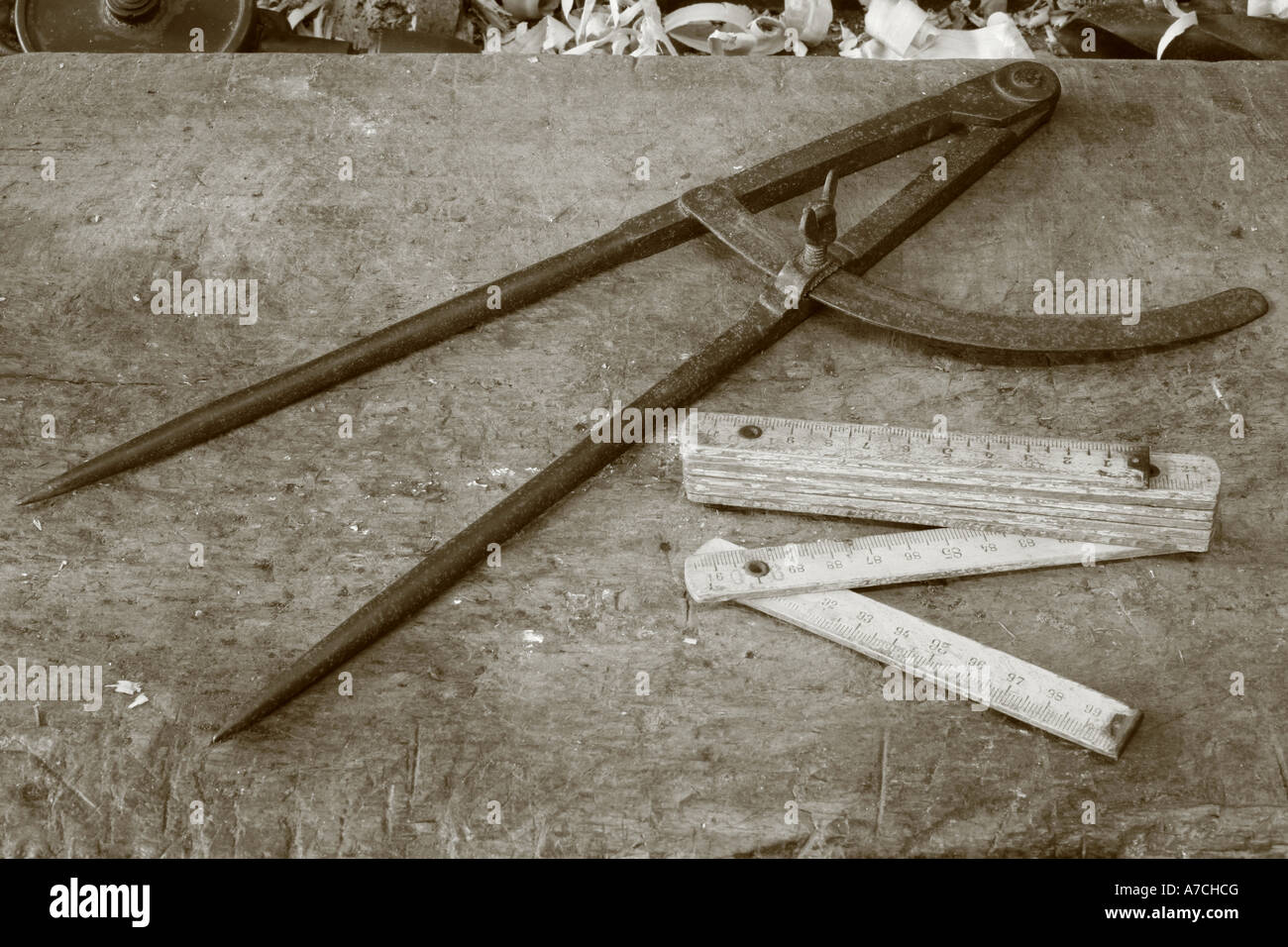 Carpentry / cooperage tools. Compass and folding ruler Stock Photo - Alamy