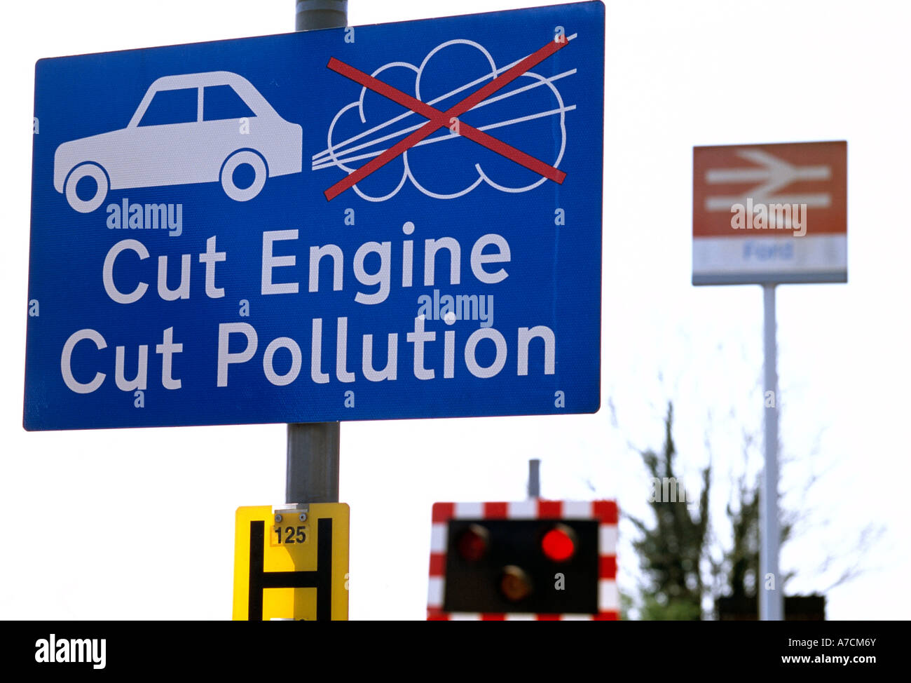 Cut Engine Cut Pollution sign at a railway crossing, Ford, West Sussex, England, UK. Stock Photo