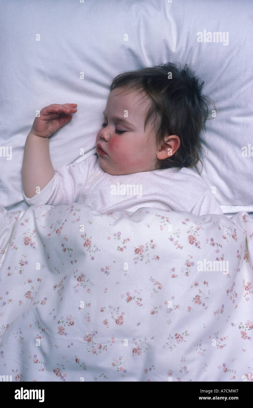 toddler ill with red cheeks asleep Stock Photo Alamy