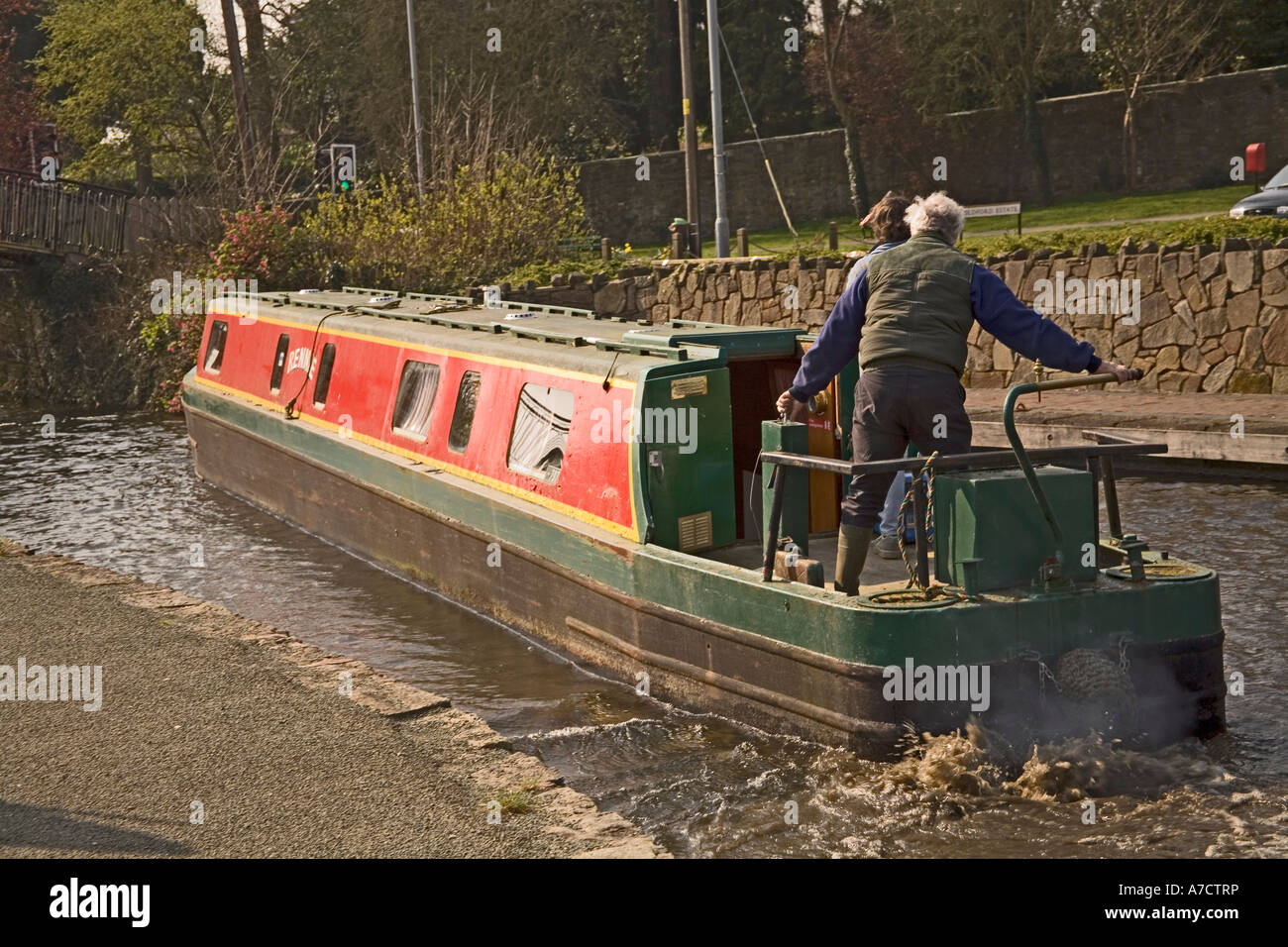 Woman steering narrowboat hi-res stock photography and images - Alamy