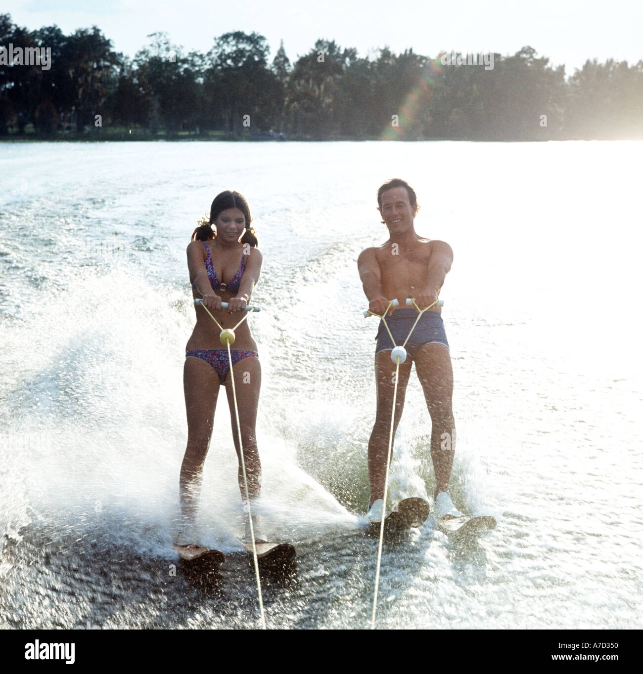 young couple water skiing Stock Photo