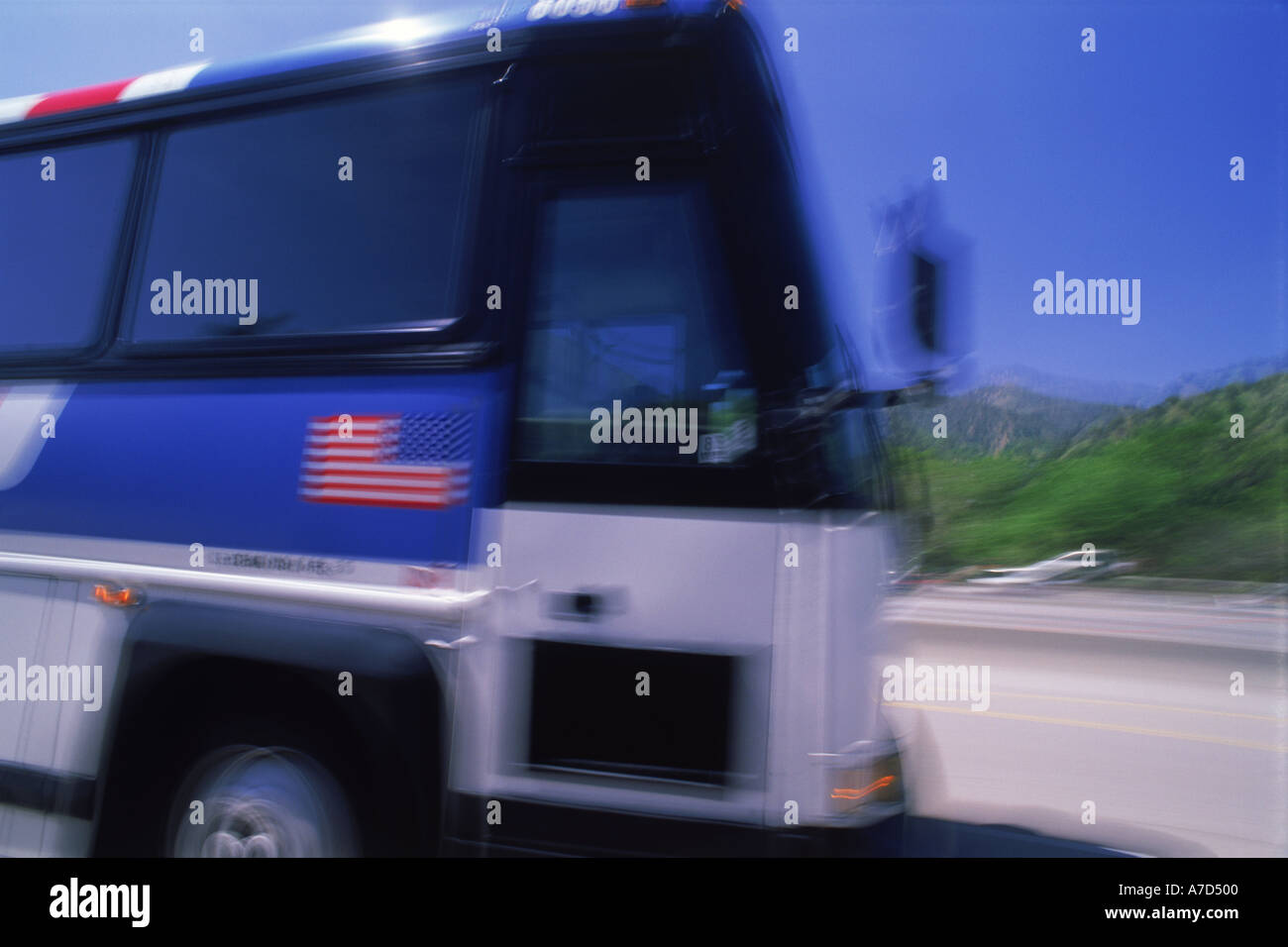 Greyhound bus in motion with USA flag Stock Photo Alamy