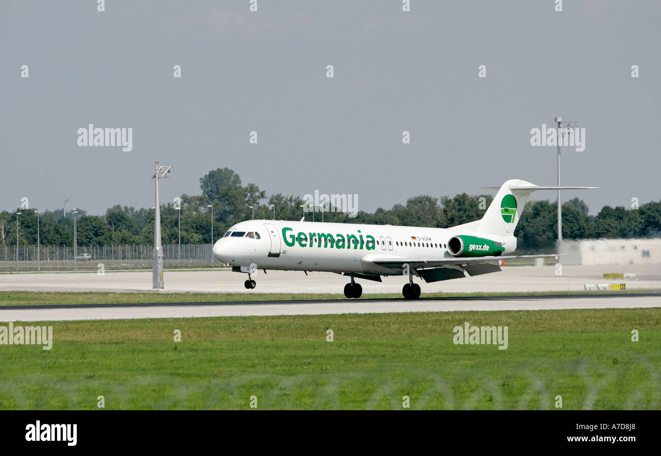 Munich, GER, 11. Aug. 2005 - A jet FOKKER F100 of GERMANIA touch down at Munich Airport. Stock Photo