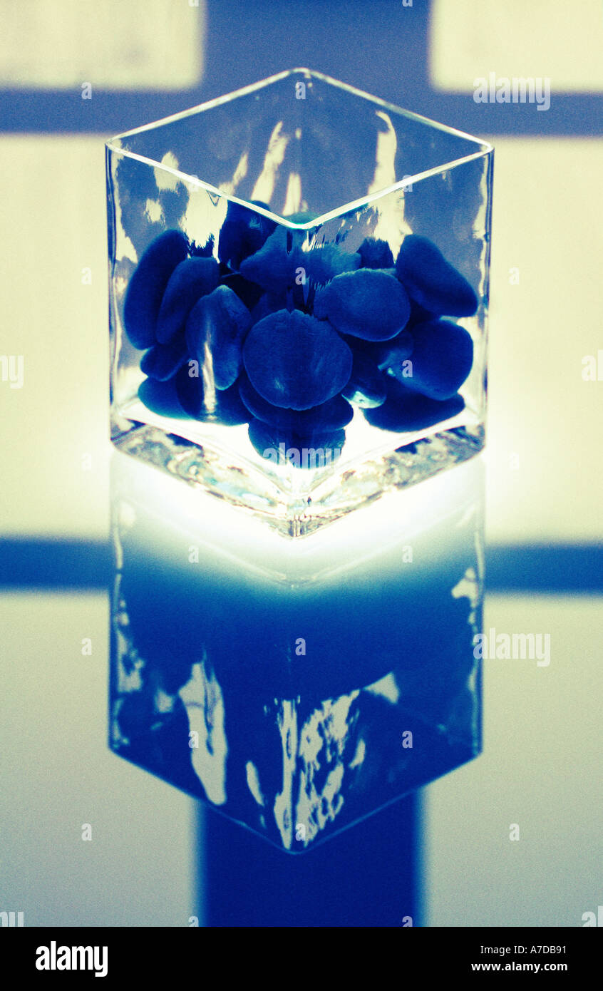 Pebbles in glass vase with glow Stock Photo Alamy